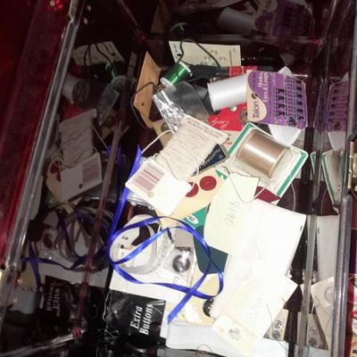 Plastic sewing box full of sewing notions, Thread, pin cushions, pins, and much more