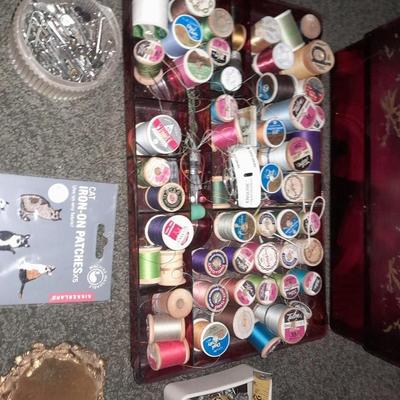 Plastic sewing box full of sewing notions, Thread, pin cushions, pins, and much more