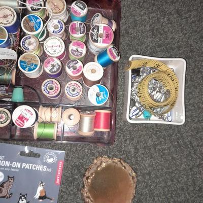Plastic sewing box full of sewing notions, Thread, pin cushions, pins, and much more