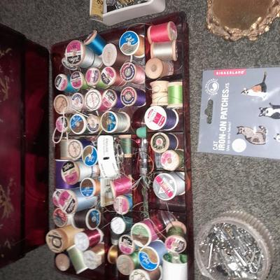 Plastic sewing box full of sewing notions, Thread, pin cushions, pins, and much more
