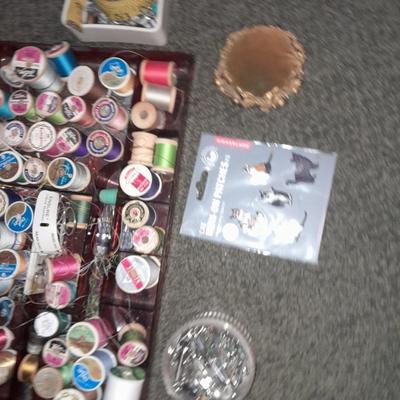 Plastic sewing box full of sewing notions, Thread, pin cushions, pins, and much more