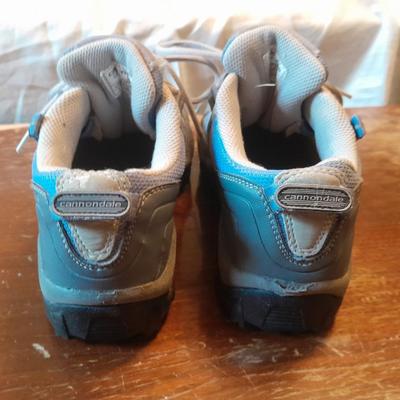 Two pair of Women's shoes Cannondale size 7 Merrell size 8