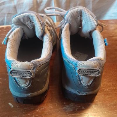 Two pair of Women's shoes Cannondale size 7 Merrell size 8