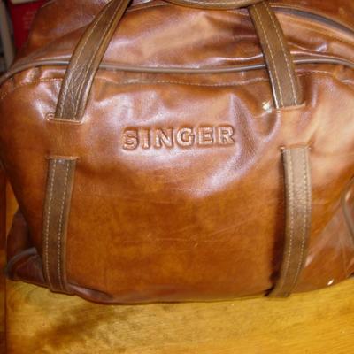Vintage Singer sewing machine in original carrying bag.