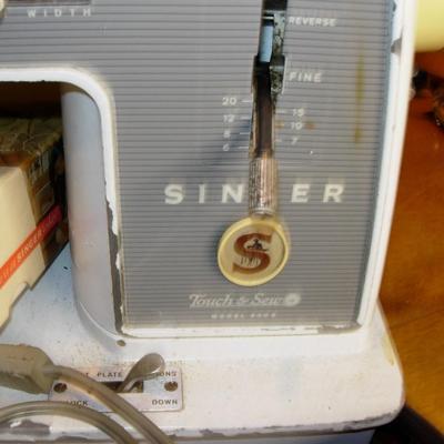 Vintage Singer sewing machine in original carrying bag.