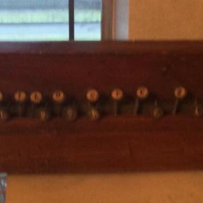 Stringed instrument with keys, wall hanger