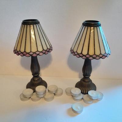 Two matching tea lamps with glass shades and tea candles