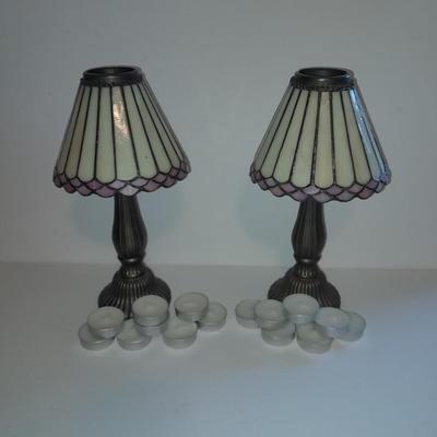 Two matching tea lamps with glass shades and tea candles