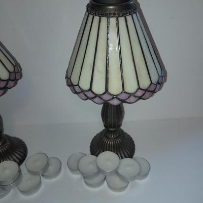Two matching tea lamps with glass shades and tea candles