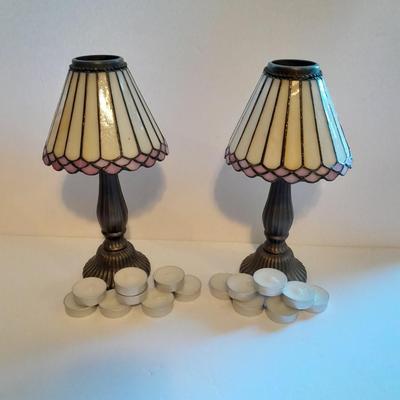 Two matching tea lamps with glass shades and tea candles