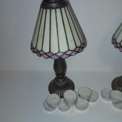 Two matching tea lamps with glass shades and tea candles
