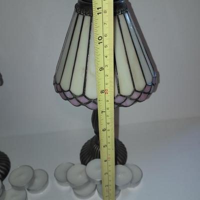Two matching tea lamps with glass shades and tea candles