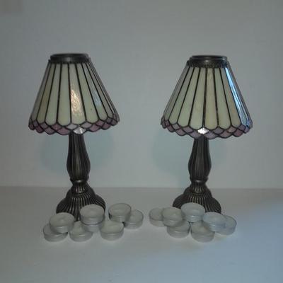 Two matching tea lamps with glass shades and tea candles