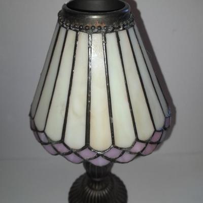 Two matching tea lamps with glass shades and tea candles