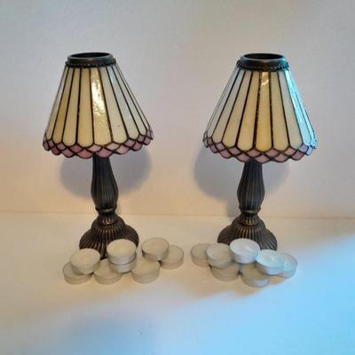 Two matching tea lamps with glass shades and tea candles