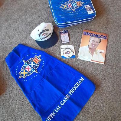 Bronco's collectible items from Superbowl and John Elway Seat cushion, Apron John Elway ticket stub