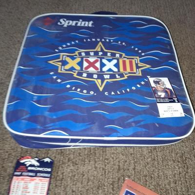 Bronco's collectible items from Superbowl and John Elway Seat cushion, Apron John Elway ticket stub