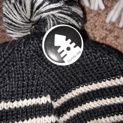 Winter wear, White, Black, and Gray scarves with a pair of Columbia gloves and stocking cap