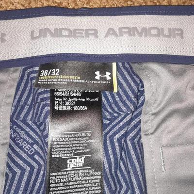 Two pair of Men's pants 38/ 32 Under armor and XL Helly Hansen