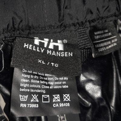 Two pair of Men's pants 38/ 32 Under armor and XL Helly Hansen