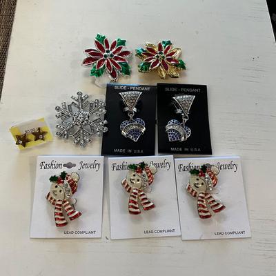 412 Eight Christmas Brooches/ Pendants and Star Earrings