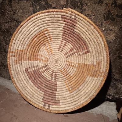 15" woven coil basket with small divination object basket decorated with feathers and fur