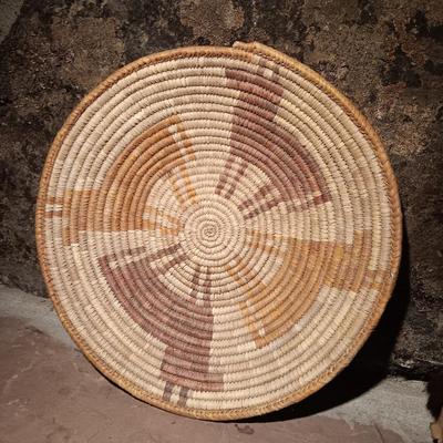 15" woven coil basket with small divination object basket decorated with feathers and fur