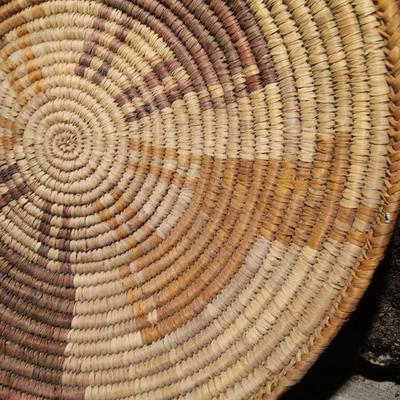 15" woven coil basket with small divination object basket decorated with feathers and fur