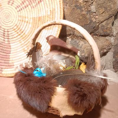 15" woven coil basket with small divination object basket decorated with feathers and fur