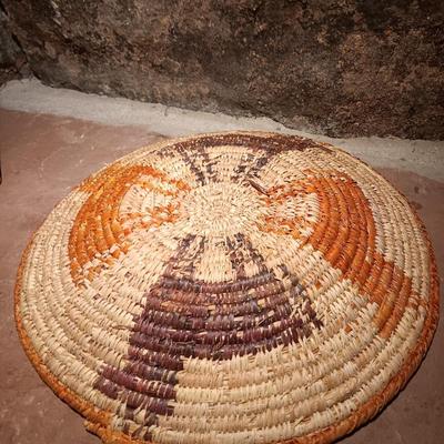15" woven coil basket with small divination object basket decorated with feathers and fur