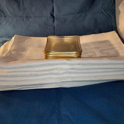 Six small sushi plates with 6 white linen napkins