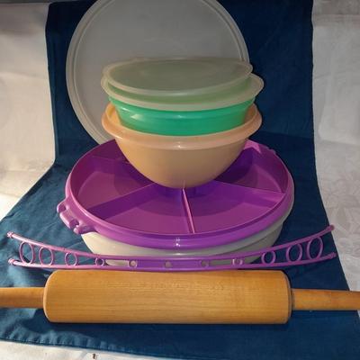 Lidded Tupperware storage containers and a wooden Rolling pin