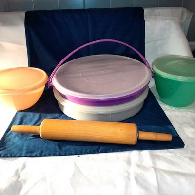 Lidded Tupperware storage containers and a wooden Rolling pin