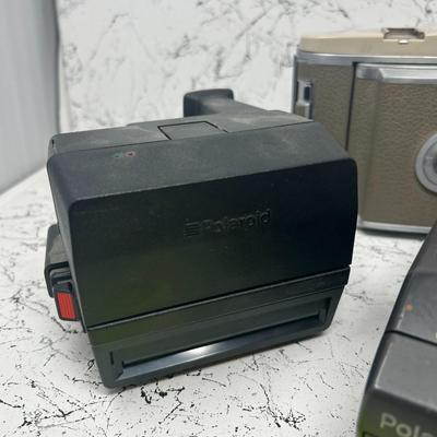 4 Vintage Polaroid Cameras