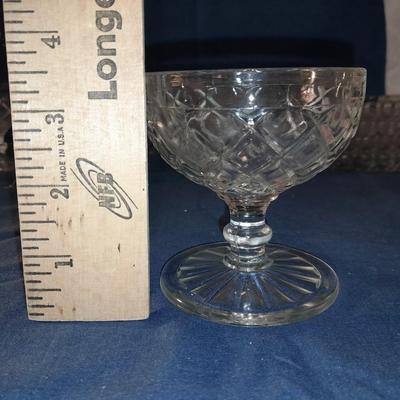 Glass snack plates with stemware and a bowl