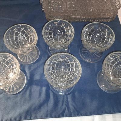 Glass snack plates with stemware and a bowl