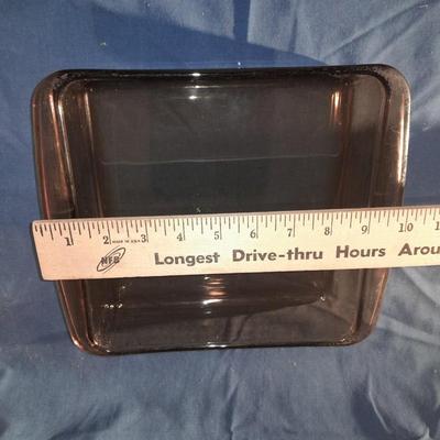 Two glass Pyrex baking dishes and a fancy pastry decorating set