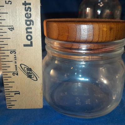 Three glass canisters with lids
