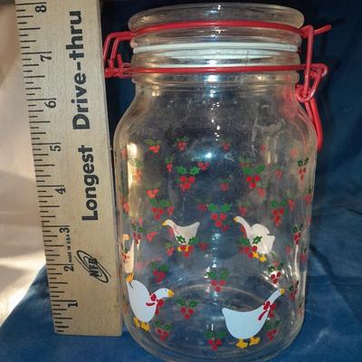Three glass canisters with lids