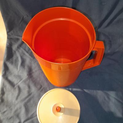 Vintage Tupperware pitcher and cake keeper with a Rubbermaid food storage container