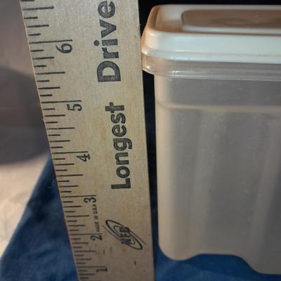 Vintage Tupperware pitcher and cake keeper with a Rubbermaid food storage container