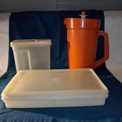 Vintage Tupperware pitcher and cake keeper with a Rubbermaid food storage container