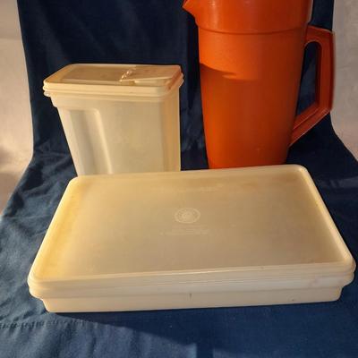 Vintage Tupperware pitcher and cake keeper with a Rubbermaid food storage container