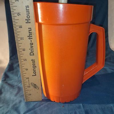 Vintage Tupperware pitcher and cake keeper with a Rubbermaid food storage container