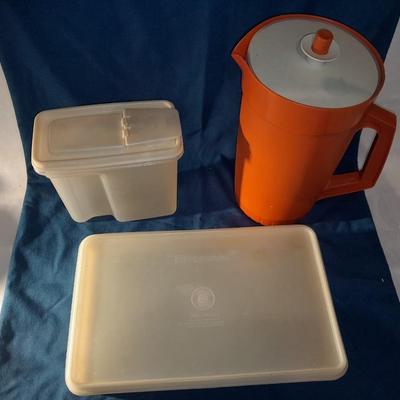 Vintage Tupperware pitcher and cake keeper with a Rubbermaid food storage container