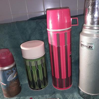 Vintage thermoses and wine corks