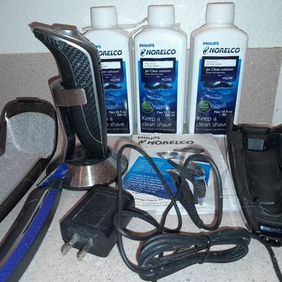 Electric razors with chargers and shaving cleaner