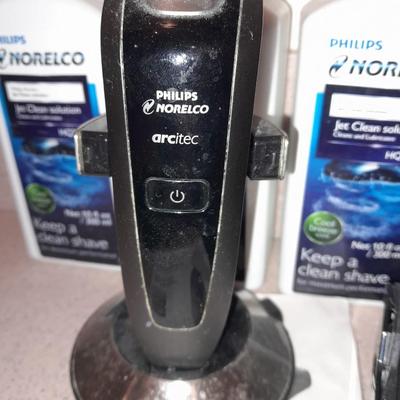 Electric razors with chargers and shaving cleaner