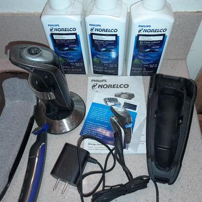 Electric razors with chargers and shaving cleaner