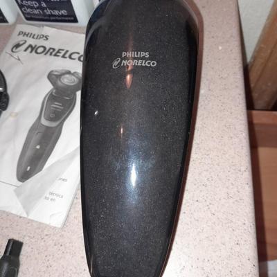 Electric razors with chargers and shaving cleaner